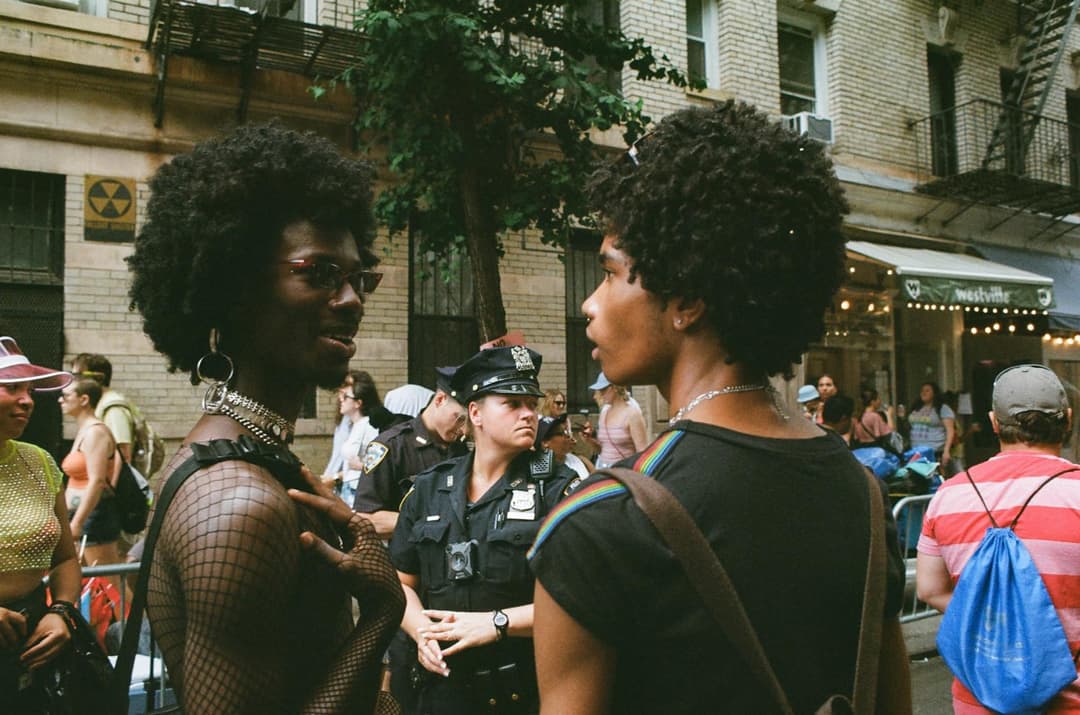 Two people sharing a conversation on a city street