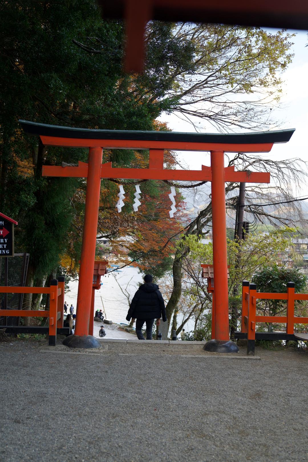 Figure beneath the vermilion gate – Kyoto, Japan