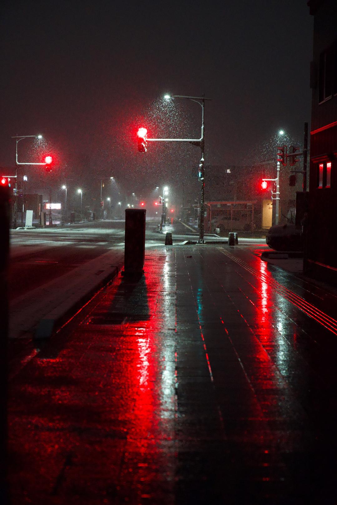Red lights in snowfall – Yamagata, Japan