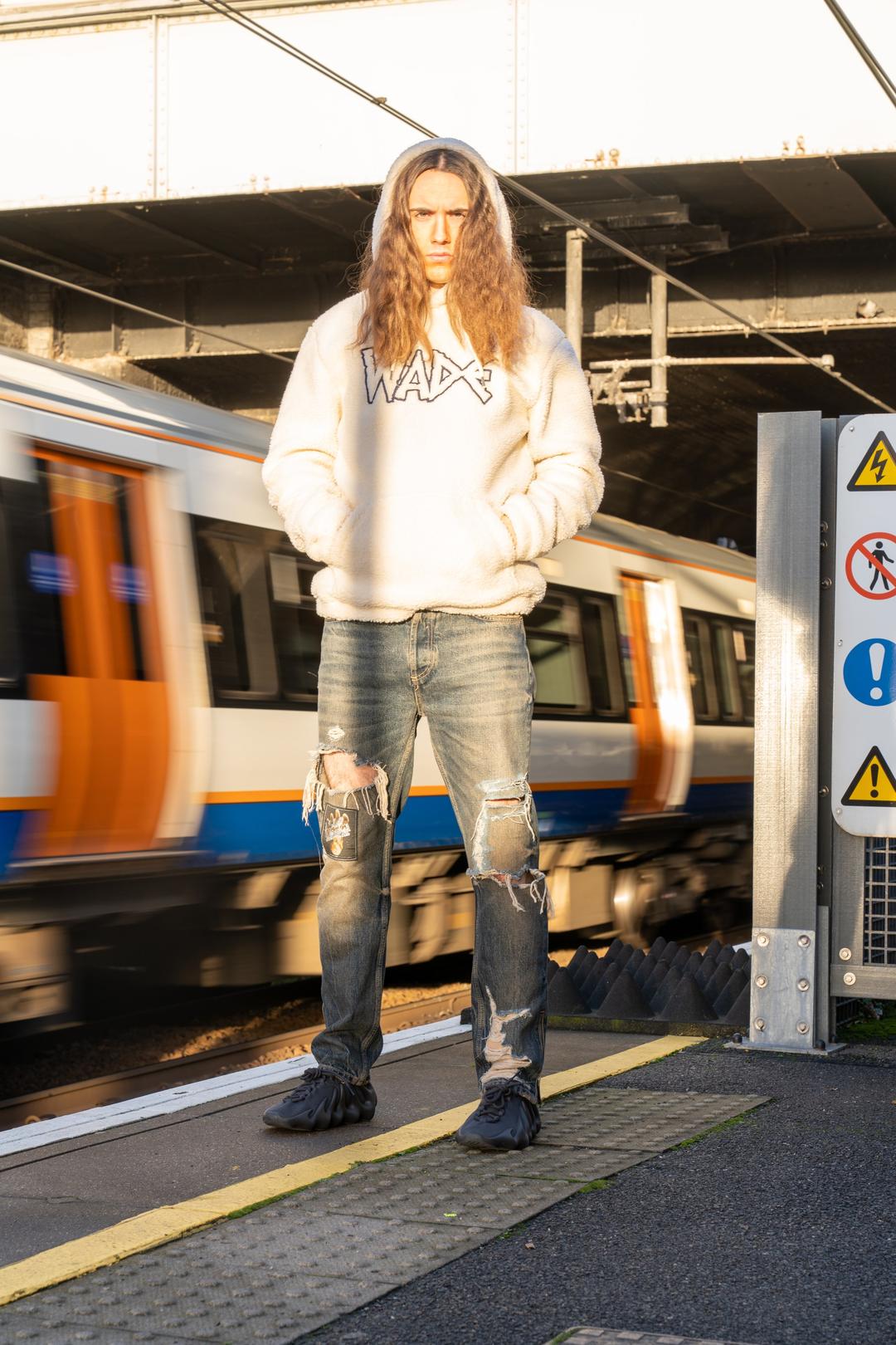White hoodie and train – London